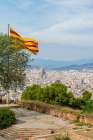 Catalan flag over the Montjuic Castle old fortress, Montjuic Mountain overlooking Barcelona, Spain. Art Print